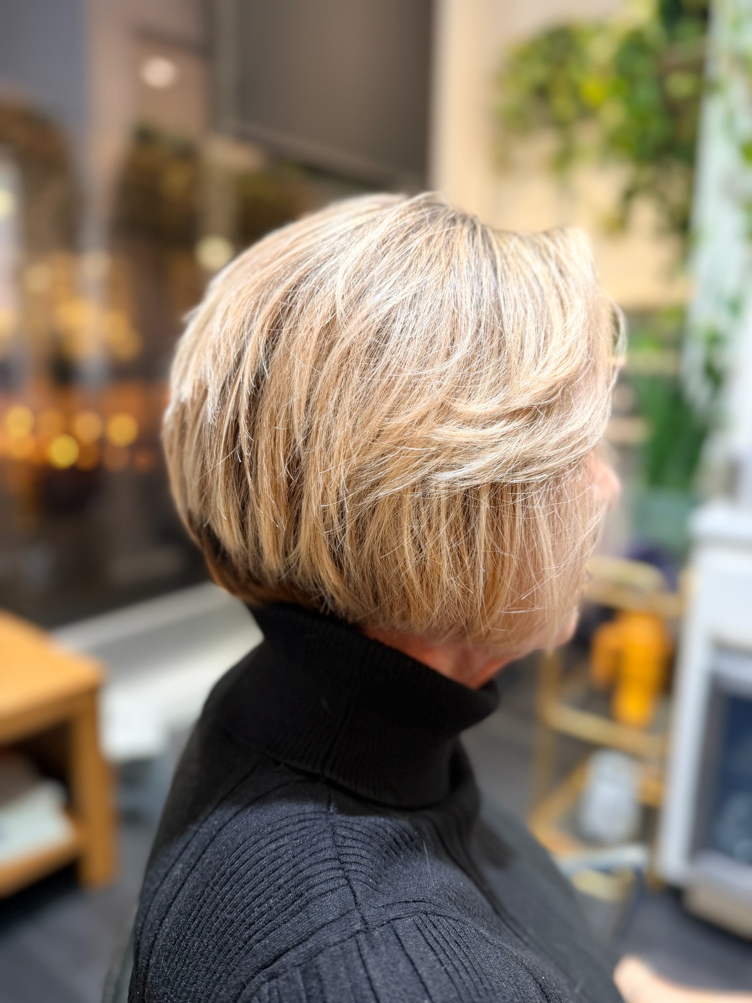 Short curly brunette haircut by Sonias