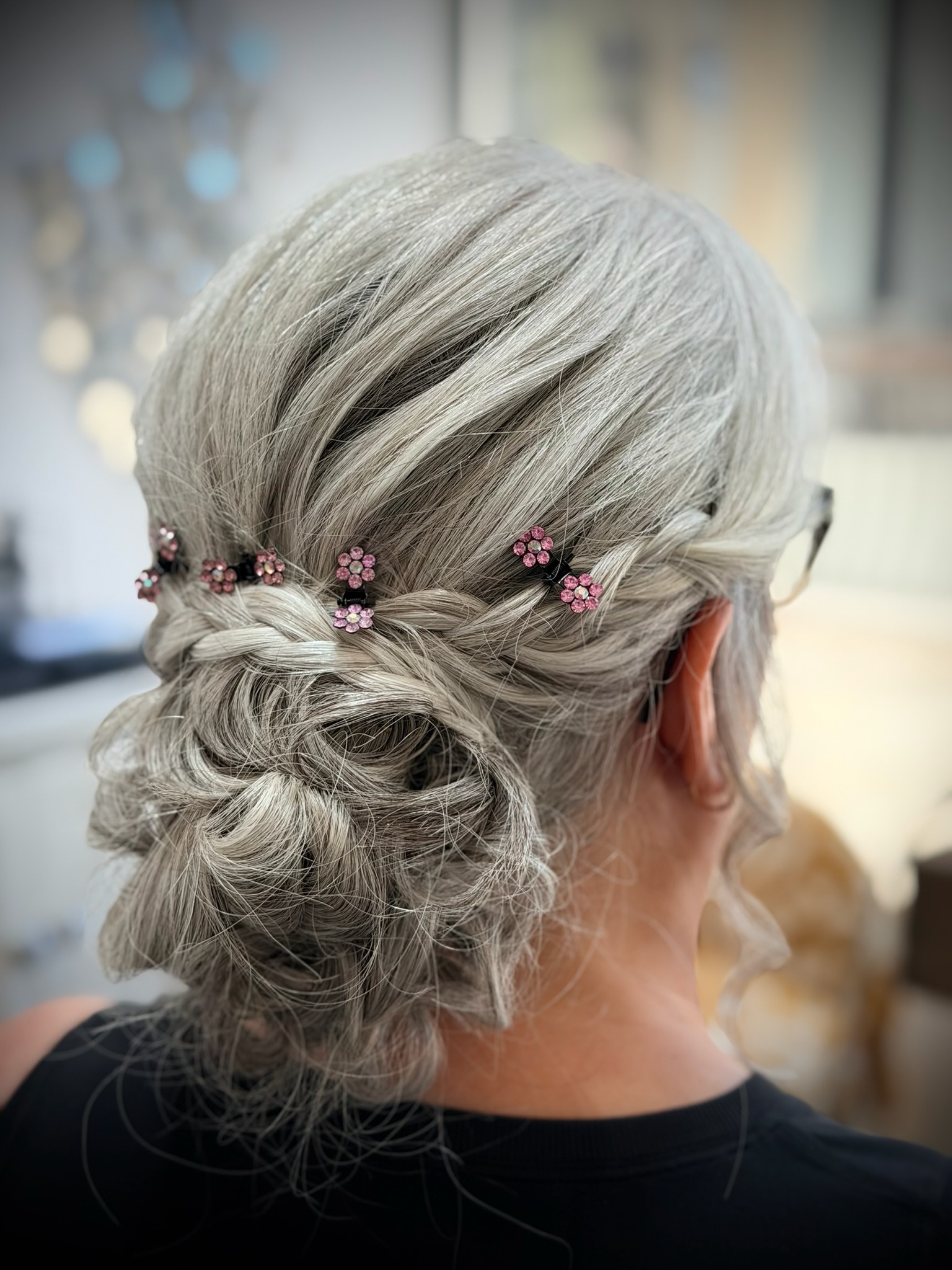 Sophisticated updo hair styling by Sonia's